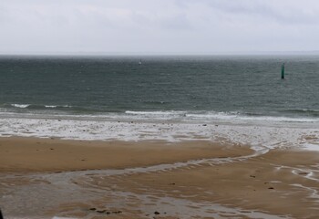 beach and sea under the rain 