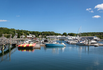 Fototapeta na wymiar Boats and Lobster docks in Boothbay Harbor Maine on a sunny summer day