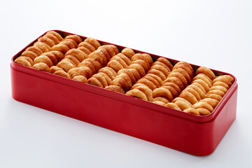 Closeup metal gift box full of biscuits, on white background