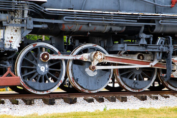 Naklejka premium A vintage set of train wheels and gears on a train track