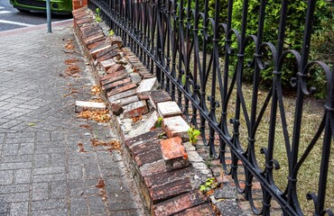 the old brick fence needs to be repaired.