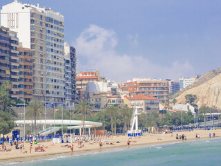 Modern residential buildings overlooking the long beach in Alicante, Costa Blanca, Spain.