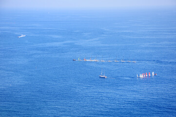 Fototapeta premium Yachts of a sailing regatta in the sea. Transportation, travel, cruise, sport, recreation, leisure activity, racing, regatta.