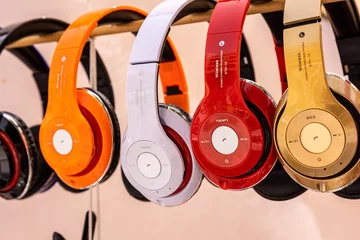 Aluminium Prints Music store Closeup shot of colorful headphones in a shop