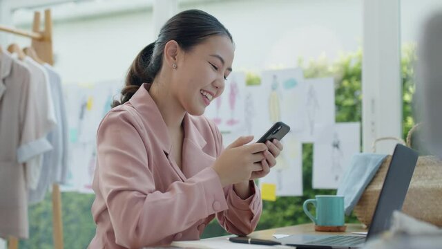 Asia happy people or lady excited sell smile enjoy good news work at home studio office store shop read text of bank fund money approve with crazy joy, sale job win. P2P microfinance app for SME sale.