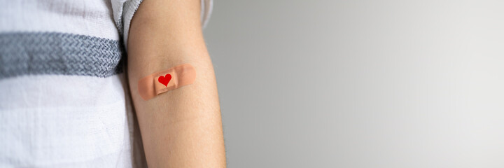 Blood Donation Concept. African American Donor With Band Aid