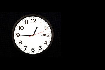 Clock on black background with copy space right side