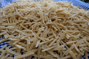 Preparing process of homemade Turkish noodle, selective focus. Noodles are the pasta that Turkish women make. It is called 