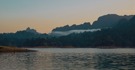 Cheow Lan lake in Khao Sok National Park, Thailand. Tropical landscape at the dawn postcard poster wallpaper