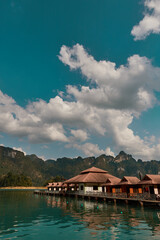 Fototapeta premium Luxury raft houses resort on Cheow Lan lake in Khao Sok National Park, Thailand. Postcard, poster, wallpaper