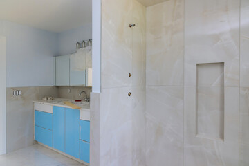 Fototapeta na wymiar Designer renovation construction bathroom with bath tub shower