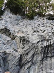 A view from below of the marble section of the Marble Canyon in the Ruskeala Mountain Park on a sunny summer day.