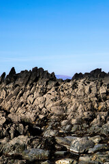 Rugged basalt stairway with peak of mountain in background