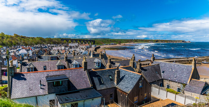A view across the roof tops and down the coast of the town of  Cullen, Scotland on a summers day