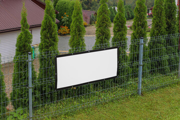Mock-up of a rectangular poster on the fence from the wire