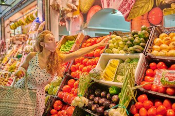 Young woman at the groceries street market