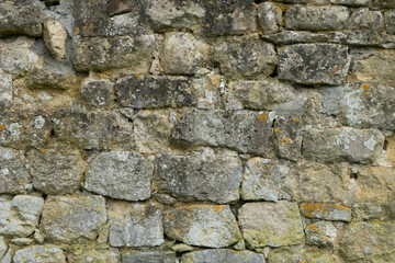 Old stone brick wall texture with mold