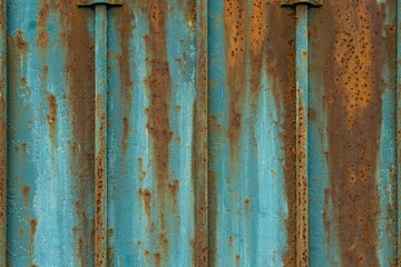 Texture rusty metal door  with brown and blue bars