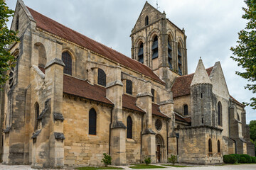 Fototapeta na wymiar The Church of Notre Dame de Auvers-sur-Oise, site of a painting by Vincent Van Gogh