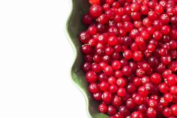 Juicy cranberries in a leaf-shaped plate