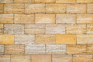 Fototapeta premium Texture of a stone wall made of shell rock blocks. Brick wall from blocks of natural origin.