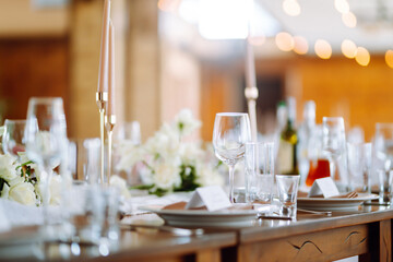 Neatly decorated table for the event. Beautiful serving. Wedding, birthday, party, event concept.