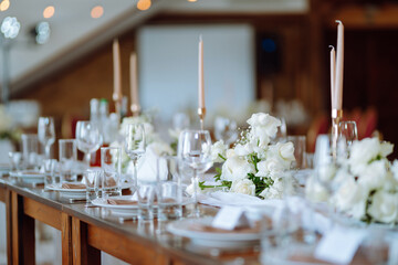 Neatly decorated table for the event. Beautiful serving. Wedding, birthday, party, event concept.
