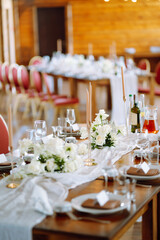Neatly decorated table for the event. Beautiful serving. Wedding, birthday, party, event concept.