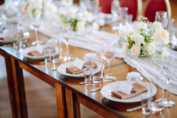 Neatly decorated table for the event. Beautiful serving. Wedding, birthday, party, event concept.