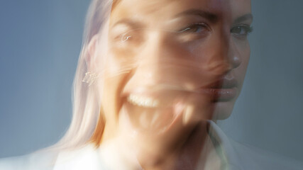 young stylish woman in a white jacket, distortions of the model's face