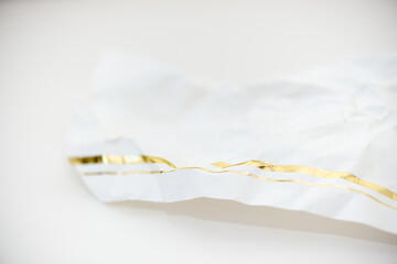 crumpled paper with gold border - macro lens, shallow depth of field