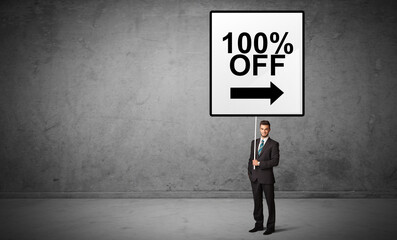 Obraz premium business person holding a traffic sign concept