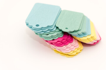 retro pastel merchandise tags piled together on a light background