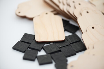 black chalk tiles with plain wood tags on a white background