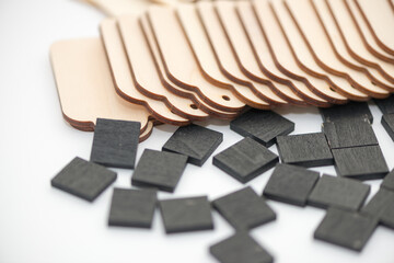 black chalk tiles with plain wood tags on a white background