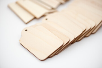 old fashioned plain wooden merchandise tags or labels on a white background