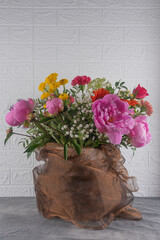 Large and beautiful bouquet with peonies, roses on a white background. Congratulation concept.
