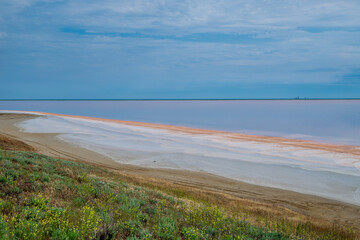 Lake Koyashskoye. Pink-orange lake, you can see the coastline with a salt crust