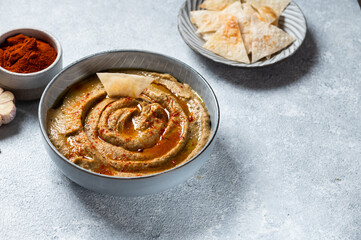 Arabic food baba ganoush close-up on the plate and ingredients on the table. Babaganush or eggplant caviar. Baked eggplant. Turkish eggplant dip baba ganoush
