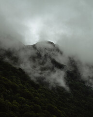 Fog in a big mountain in a cloudy day