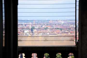 Mole Antonelliana, view of Turin from the observation deck through protective grid, Italy.