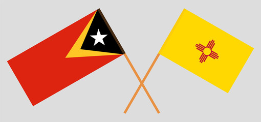 Crossed flags of East Timor and the State of New Mexico. Official colors. Correct proportion