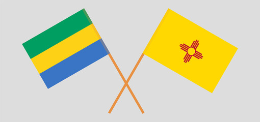 Crossed flags of Gabon and the State of New Mexico. Official colors. Correct proportion