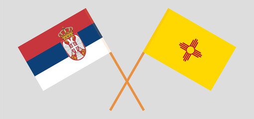 Crossed flags of Serbia and the State of New Mexico. Official colors. Correct proportion