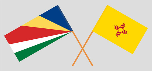 Crossed flags of Seychelles and the State of New Mexico. Official colors. Correct proportion