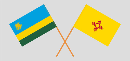 Crossed flags of Rwanda and the State of New Mexico. Official colors. Correct proportion