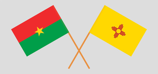 Crossed flags of Burkina Faso and the State of New Mexico. Official colors. Correct proportion