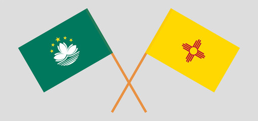 Crossed flags of Macau and the State of New Mexico. Official colors. Correct proportion