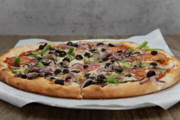 Vegetarian pizza loaded with vegetable toppings and a crispy crust for a full family meal