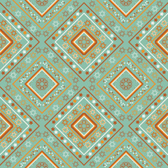 ethnics pattern with geometric seamless flower in green background for fabric